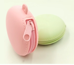 Detailed macro view of pastel silicone macaron coin purses with zipper and metal key ring