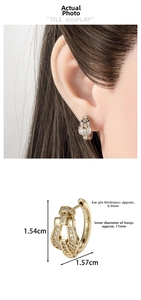 Detailed view of pavé zircon horseshoe earrings with 11mm inner diameter dimensions