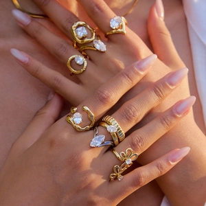 18K gold plated stainless steel double layer ring set with white zircon stones on a hand