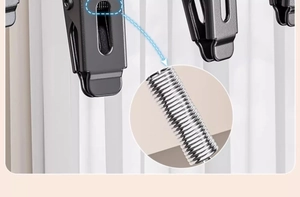 Macro shot of the heavy duty stainless steel internal spring on the black drying clip
