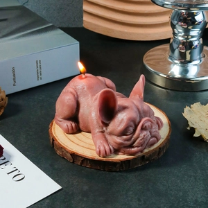 Macro detail of French Bulldog scented candle showing skin textures on a wooden base