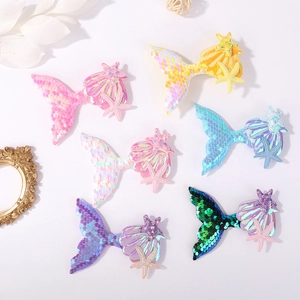Glittering mermaid tail and shell hair clips in pastel sequins for girls' hair styling