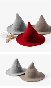 Detail of multi-color pointed witch hats in red and grey wool knit texture