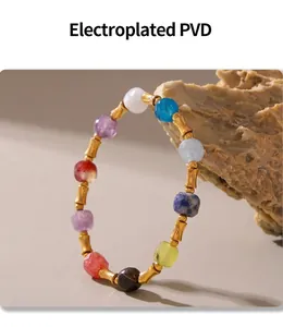 Detail of PVD gold plated beads and colorful natural semi-precious stones on a boho bracelet