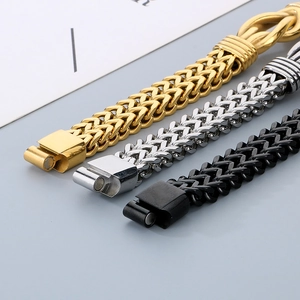 Macro shot of titanium steel braided rope bracelets with magnetic clasps in gold and silver