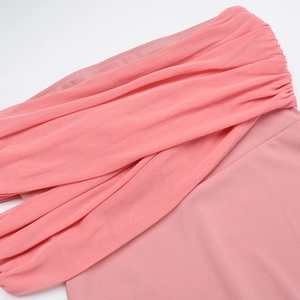 Detail of elegant pink off-shoulder dress with pleated chiffon and knit fabric textures