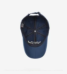 Detail of navy blue cotton baseball cap interior with 6-panel stitching and sweatband