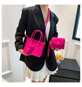 Pink faux crocodile leather handbag set shown with matching mini pouch and flap card holder