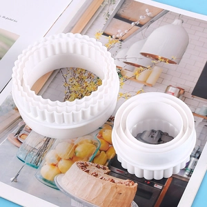 6-piece set of white plastic round pastry cutters with scalloped and smooth edges for DIY baking