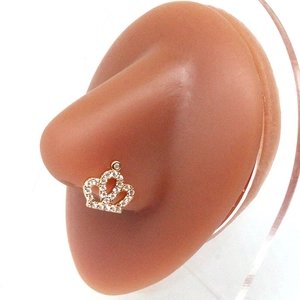 Elegant gold crown nose stud with sparkling crystals shown on a mannequin model