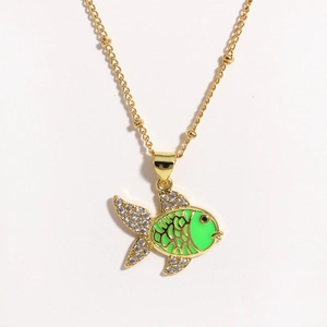 Detail of goldfish pendant with green enamel and clear crystals on a gold chain