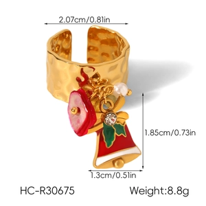 Detail showing Christmas bell charm ring size 2.07cm and hammered gold texture
