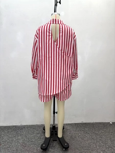 Rear view of red and white striped long sleeve shirt set featuring back slit tie detail