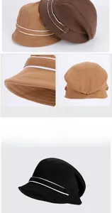 Detail view of stylish beret hats showing adjustable metal buckles and stripe accents