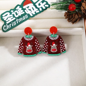 Detail of Christmas reindeer sweater earrings with red glitter finish on velvet gift box
