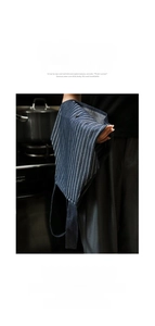 Detail showing deep blue striped apron with absorbent side hand-wiping towels for kitchen
