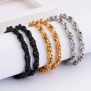 Three-color twisted rope chain bracelets in gold, black, and silver stainless steel