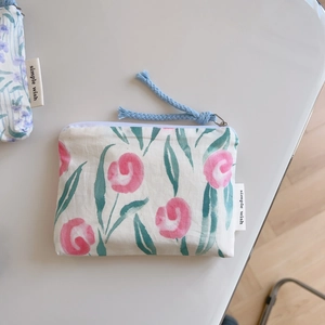 Close-up of a floral cotton zipper pouch for cosmetics and small accessories