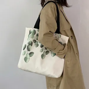 Japanese style white canvas tote bag with eucalyptus print and black strap for daily use