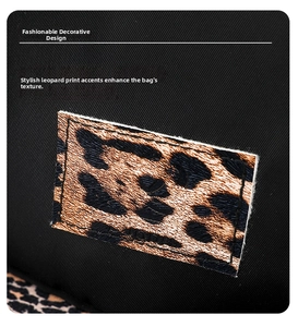 Detailed macro view of stylish leopard print patch and stitching on black nylon backpack