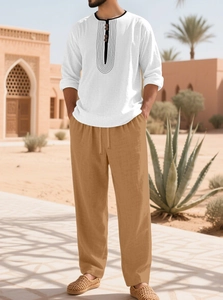 Men's white cotton linen henley shirt and khaki drawstring pants set in desert scene