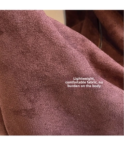 Macro detail of high-quality frosted leather fabric texture on this large burgundy tote bag