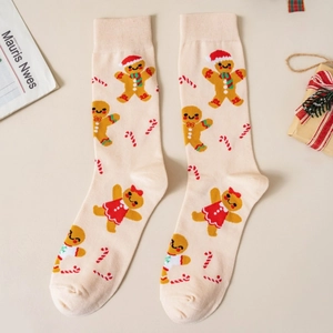Detailed knit of beige Christmas crew socks with gingerbread man and candy cane patterns