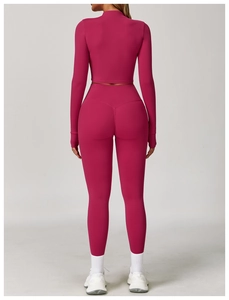 Detail view of high-waist rose red yoga pants with seamless push-up lifting design