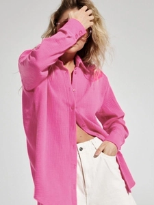 Detail of rose red cotton crepe shirt featuring breathable wrinkled texture and relaxed fit