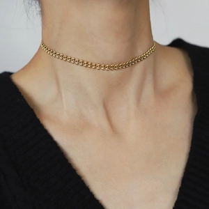 18K gold plated wheat ear link choker necklace on model wearing black V-neck top