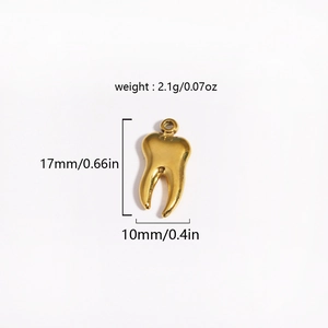 Detailed view of a gold tooth pendant showing dimensions 17mm by 10mm and 2.1g weight