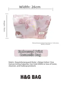 Pink jacquard makeup bag with butterfly floral patterns, measuring 26cm wide and 18cm high
