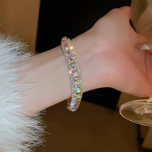 Close-up of luxury silver bracelet with sparkling round rhinestones on a woman's wrist