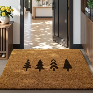 Macro detail of natural coconut fiber doormat with decorative black Christmas tree patterns