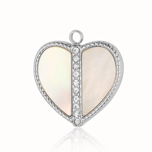 Macro detail of silver heart pendant featuring white shell inlay and pave crystal accents