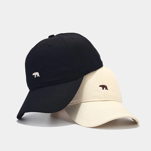 Minimalist cotton baseball cap with polar bear embroidery in black and beige colors