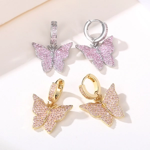 Exquisite gold and silver butterfly earrings inlaid with sparkling pink zircon crystals