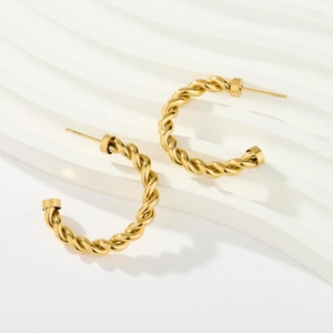 18K gold C-shaped hoop earrings with elegant twisted texture for a minimalist style
