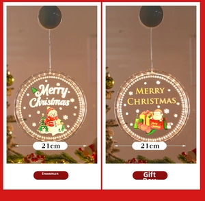 Detail view of 21cm LED Christmas suction cup lights with snowman and gift box patterns