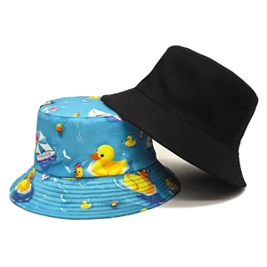 Double-sided reversible bucket hat in black and blue with cartoon duck prints