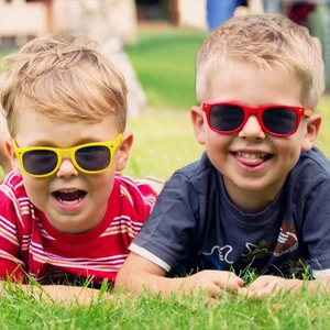 Kids neon classic party sunglasses, colorful summer beach eyewear for boys and girls lifestyle.
