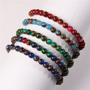 Detail showing 6mm natural stone beaded bracelets with marble patterns in diverse colors