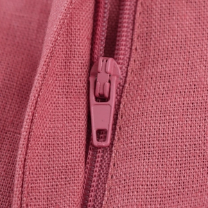 Close-up of pink zipper and matching woven texture on a sleeveless two-piece vest set