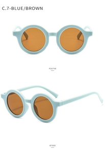 Detail view of round frame baby sunglasses in matte blue with UV400 dark brown lenses