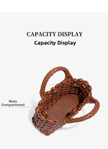 Top view of brown woven tote bag showing the spacious main compartment and metal rings