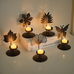 Black metal iron tea light candle holder set with leaf and butterfly nature motifs