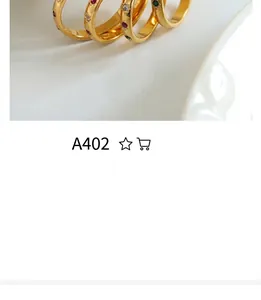 Detail of adjustable gold-plated titanium rings with colorful enamel drip oil inlays