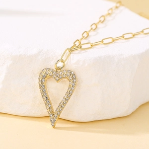 Elegant 18K gold plated heart pendant necklace with shimmering zircon stones on stone
