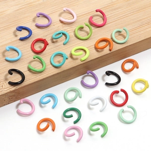 Vibrant assortment of multi-colored iron open jump rings for DIY jewelry crafting