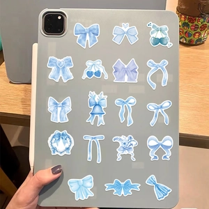 Detailed view of blue watercolor ribbon stickers applied on a tablet case surface